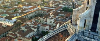 Movie still from “6 Underground” (2019), directed by Michael Bay – An aerial view of a large city with a lot of buildings; Extreme Wide shot, High angle
