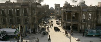 Movie still from “6 Underground” (2019), directed by Michael Bay – An image of an old city with a lot of people in it; Extreme Wide shot, High angle