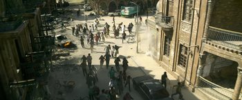 Movie still from “6 Underground” (2019), directed by Michael Bay – A group of people walking down a street; Extreme Wide shot, High angle