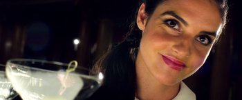 Movie still from “6 Underground” (2019), directed by Michael Bay – A woman's face with her hair in a ponytail; Close Up shot, Overhead angle