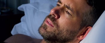 Movie still from “6 Underground” (2019), directed by Michael Bay – A person with a beard; Extreme Close Up shot, Overhead angle