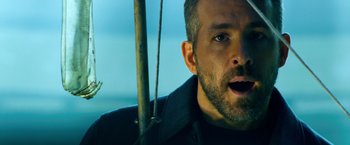 Movie still from “6 Underground” (2019), directed by Michael Bay – A person with his mouth wide open; Close Up shot, Low angle