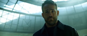 Movie still from “6 Underground” (2019), directed by Michael Bay – A person with a beard; Close Up shot, Low angle