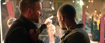 Movie still from “6 Underground” (2019), directed by Michael Bay – A man and a woman talking to each other; Close Up shot, Over the shoulder angle