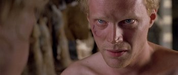 Movie still from “A Knight's Tale” (2001), directed by Brian Helgeland – A person with a bruise on his face; Close Up shot, Over the shoulder angle