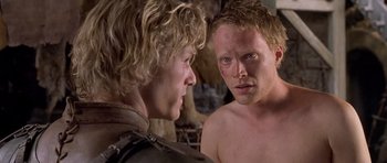 Movie still from “A Knight's Tale” (2001), directed by Brian Helgeland – A man and a woman looking at each other in front of each other; Close Up shot, Over the shoulder angle