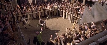 Movie still from “A Knight's Tale” (2001), directed by Brian Helgeland – A crowd of people watching a baseball game being played; Wide shot, High angle