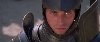 Movie still from “A Knight's Tale” (2001), directed by Brian Helgeland – A person wearing a suit of armor; Close Up shot, High angle