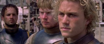 Movie still from “A Knight's Tale” (2001), directed by Brian Helgeland – Two men in medieval garb looking at the camera; Close Up shot, Low angle