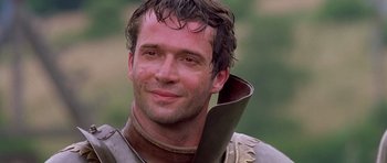 Movie still from “A Knight's Tale” (2001), directed by Brian Helgeland – A person with a sword; Close Up shot, Over the shoulder angle