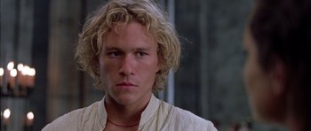 Movie still from “A Knight's Tale” (2001), directed by Brian Helgeland – A person with long blonde hair; Close Up shot, Low angle