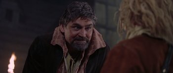 Movie still from “A Knight's Tale” (2001), directed by Brian Helgeland – A person with a beard; Close Up shot, Over the shoulder angle