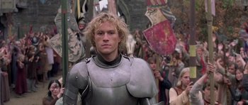Movie still from “A Knight's Tale” (2001), directed by Brian Helgeland – A person wearing a suit of armor; Close Up shot, Over the shoulder angle