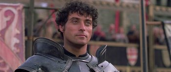 Movie still from “A Knight's Tale” (2001), directed by Brian Helgeland – A person wearing a suit of armor; Close Up shot, Over the shoulder angle