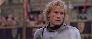 Movie still from “A Knight's Tale” (2001), directed by Brian Helgeland – A person wearing a suit of armor; Close Up shot, Over the shoulder angle