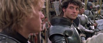 Movie still from “A Knight's Tale” (2001), directed by Brian Helgeland – Two men in medieval garb looking at each other; Close Up shot, Over the shoulder angle