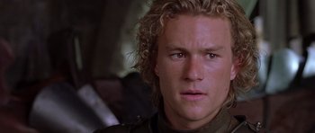 Movie still from “A Knight's Tale” (2001), directed by Brian Helgeland – A person wearing a jacket; Close Up shot, Over the shoulder angle