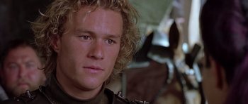 Movie still from “A Knight's Tale” (2001), directed by Brian Helgeland – A person wearing a jacket; Close Up shot, Over the shoulder angle