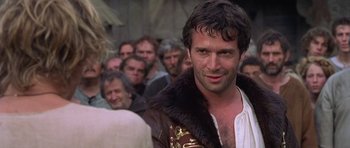 Movie still from “A Knight's Tale” (2001), directed by Brian Helgeland – A person with a crowd of people; Close Up shot, Over the shoulder angle