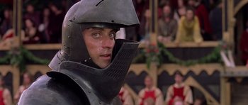 Movie still from “A Knight's Tale” (2001), directed by Brian Helgeland – A man in a suit of a medieval knight; Close Up shot, Low angle