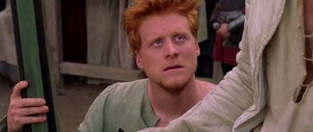 Movie still from “A Knight's Tale” (2001), directed by Brian Helgeland – A person with red hair; Close Up shot, High angle