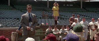 Movie still from “A League of Their Own” (1992), directed by Penny Marshall – A crowd of people watching a baseball game in a stadium; Wide shot, Over the shoulder angle
