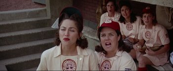 Movie still from “A League of Their Own” (1992), directed by Penny Marshall – A group of women in baseball uniforms and hats; Medium shot, Low angle