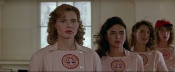 Movie still from “A League of Their Own” (1992), directed by Penny Marshall – A couple of women standing next to each other in front of a window; Close Up shot, Low angle