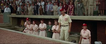 Movie still from “A League of Their Own” (1992), directed by Penny Marshall – A group of people standing in front of an audience; Medium shot, Low angle
