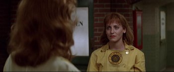 Movie still from “A League of Their Own” (1992), directed by Penny Marshall – A woman looking at herself in the mirror; Close Up shot, Over the shoulder angle