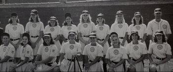 Movie still from “A League of Their Own” (1992), directed by Penny Marshall – A black and white photo of a softball team; Wide shot, High angle