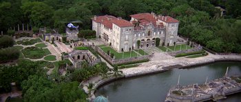 Movie still from “Airport '77” (1977), directed by Jerry Jameson – An aerial view of a large mansion with a lake; Extreme Wide shot, High angle