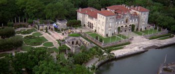 Movie still from “Airport '77” (1977), directed by Jerry Jameson – An aerial view of a mansion with a bridge in the background; Extreme Wide shot, High angle