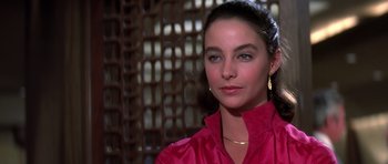 Movie still from “Airport '77” (1977), directed by Jerry Jameson – A person wearing a pink shirt; Close Up shot, Over the shoulder angle