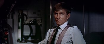 Movie still from “Airport” (1970), directed by George Seaton – A person wearing a tie; Close Up shot, Low angle