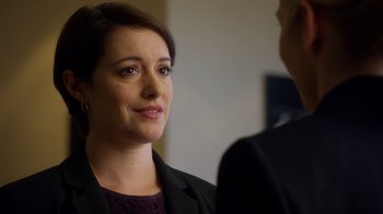 Movie still from “Better Call Saul” (2015), created by Vince Gilligan – A woman wearing a suit and looking at a man; Close Up shot, Over the shoulder angle