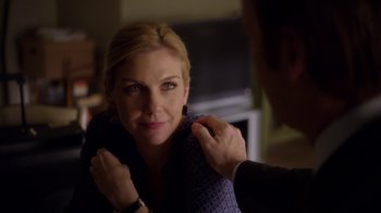 Movie still from “Better Call Saul” (2015), created by Vince Gilligan – A woman putting a scarf around a mans neck; Close Up shot, Over the shoulder angle