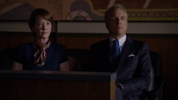 Movie still from “Better Call Saul” (2015), created by Vince Gilligan – A man and a woman standing next to each other in a room; Medium shot, Low angle