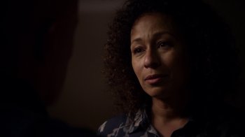 Movie still from “Better Call Saul” (2015), created by Vince Gilligan – A person with curly black hair; Close Up shot, Over the shoulder angle