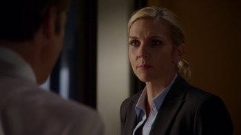 Movie still from “Better Call Saul” (2015), created by Vince Gilligan – A woman in a business suit looking at a man in a business suit; Close Up shot, Over the shoulder angle