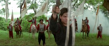 Movie still from “Asoka” (2001), directed by Santosh Sivan – A group of men in medieval garb standing next to each other; Medium shot, Low angle
