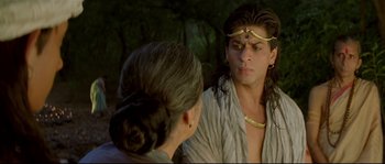 Movie still from “Asoka” (2001), directed by Santosh Sivan – A man and a woman are talking in a forest; Close Up shot, Over the shoulder angle