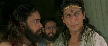 Movie still from “Asoka” (2001), directed by Santosh Sivan – A group of men standing next to each other; Close Up shot, Over the shoulder angle