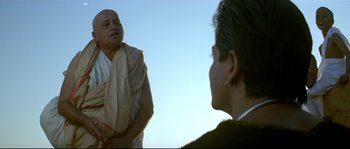 Movie still from “Asoka” (2001), directed by Santosh Sivan – A man and a woman talking to each other outside; Close Up shot, Low angle