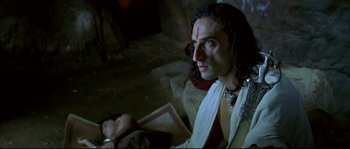 Movie still from “Asoka” (2001), directed by Santosh Sivan – A person with a doll; Close Up shot, High angle