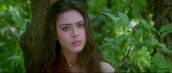 Movie still from “Asoka” (2001), directed by Santosh Sivan – A beautiful young woman with long black hair and green eyes; Close Up shot, High angle