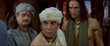 Movie still from “Asoka” (2001), directed by Santosh Sivan – A man in a turban and a white head scarf; Close Up shot, Low angle