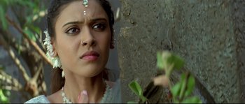 Movie still from “Asoka” (2001), directed by Santosh Sivan – A person wearing a white dress; Close Up shot, Low angle