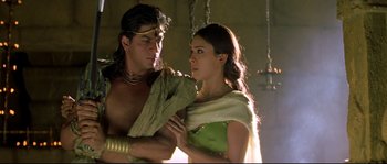Movie still from “Asoka” (2001), directed by Santosh Sivan – A man and a woman are standing next to each other; Medium shot, Low angle