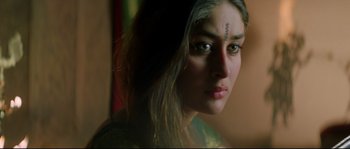 Movie still from “Asoka” (2001), directed by Santosh Sivan – A person with a face tattoo; Close Up shot, High angle